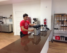 Owner, John Kepner, prepares a cup of coffee at the counter
